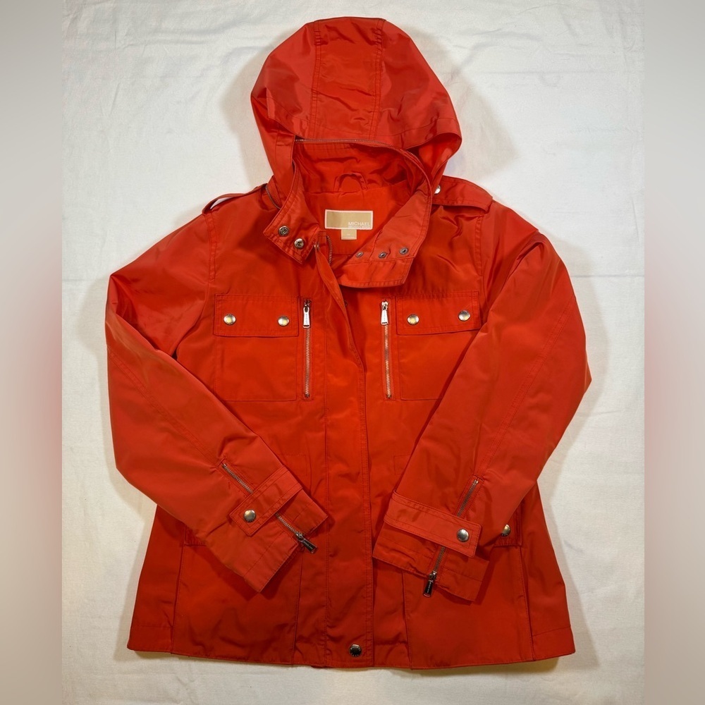 NWOT Michael Kor’s Women's Orange Hooded Rain Coat Jacket with silver details